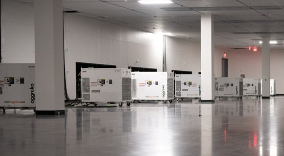 aggreko generators in a white room