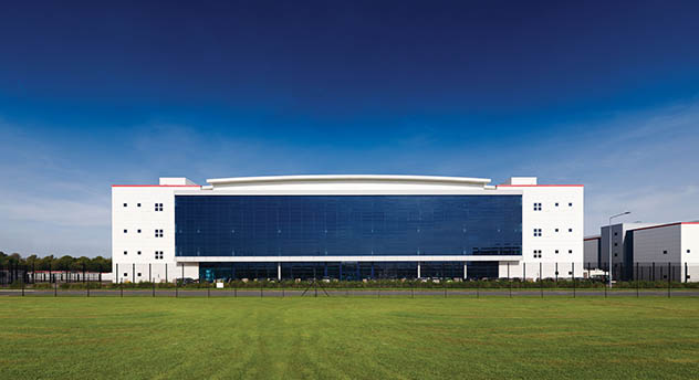 Cardiff data center as viewed across a grass lawn