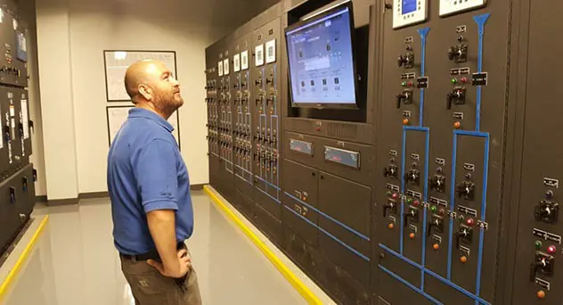 man looking at tv in data center